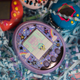 My Tamagotchi On, surrounded by its adopted siblings.